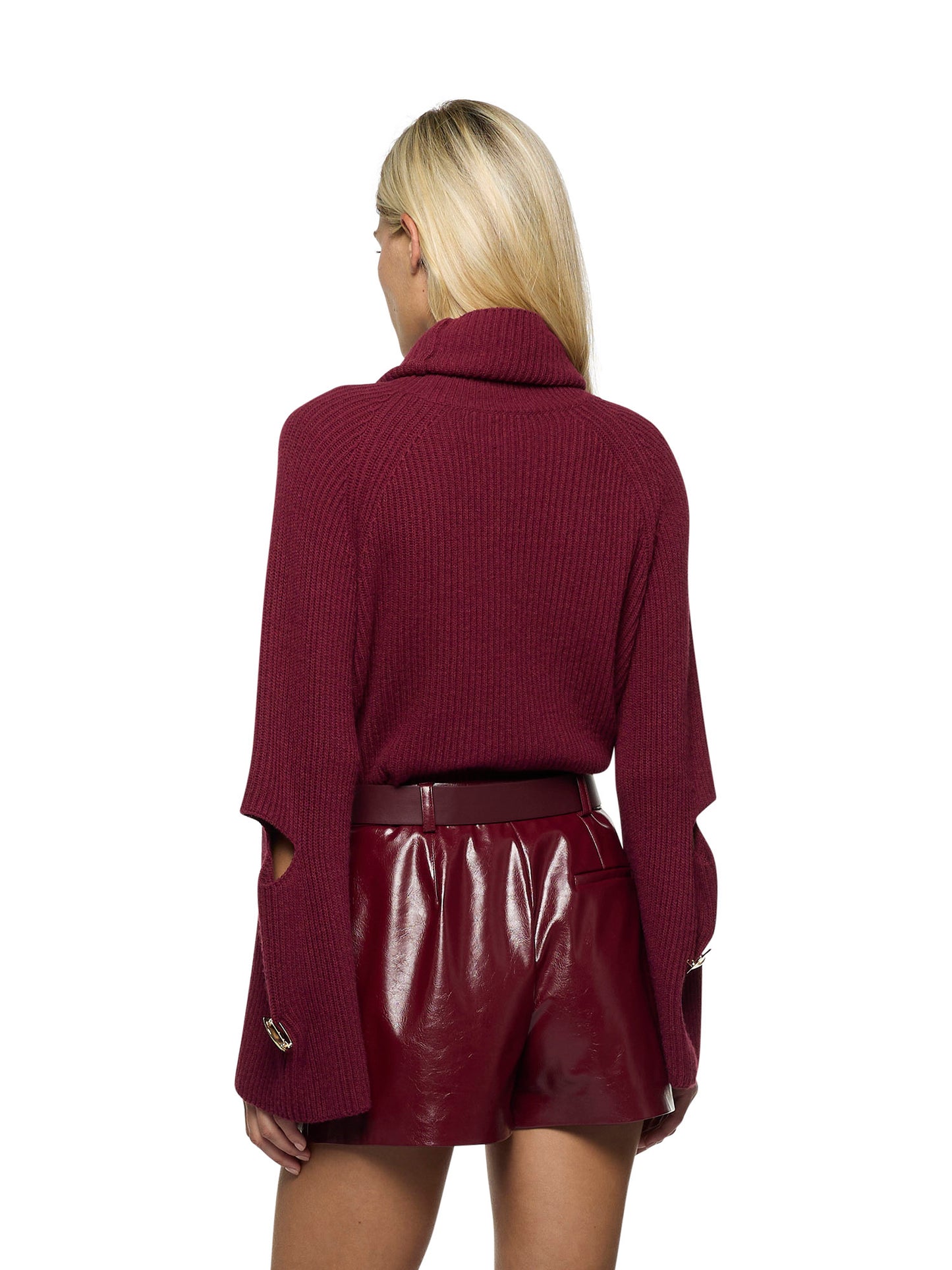Dropped-neck sweater with openings at the elbows