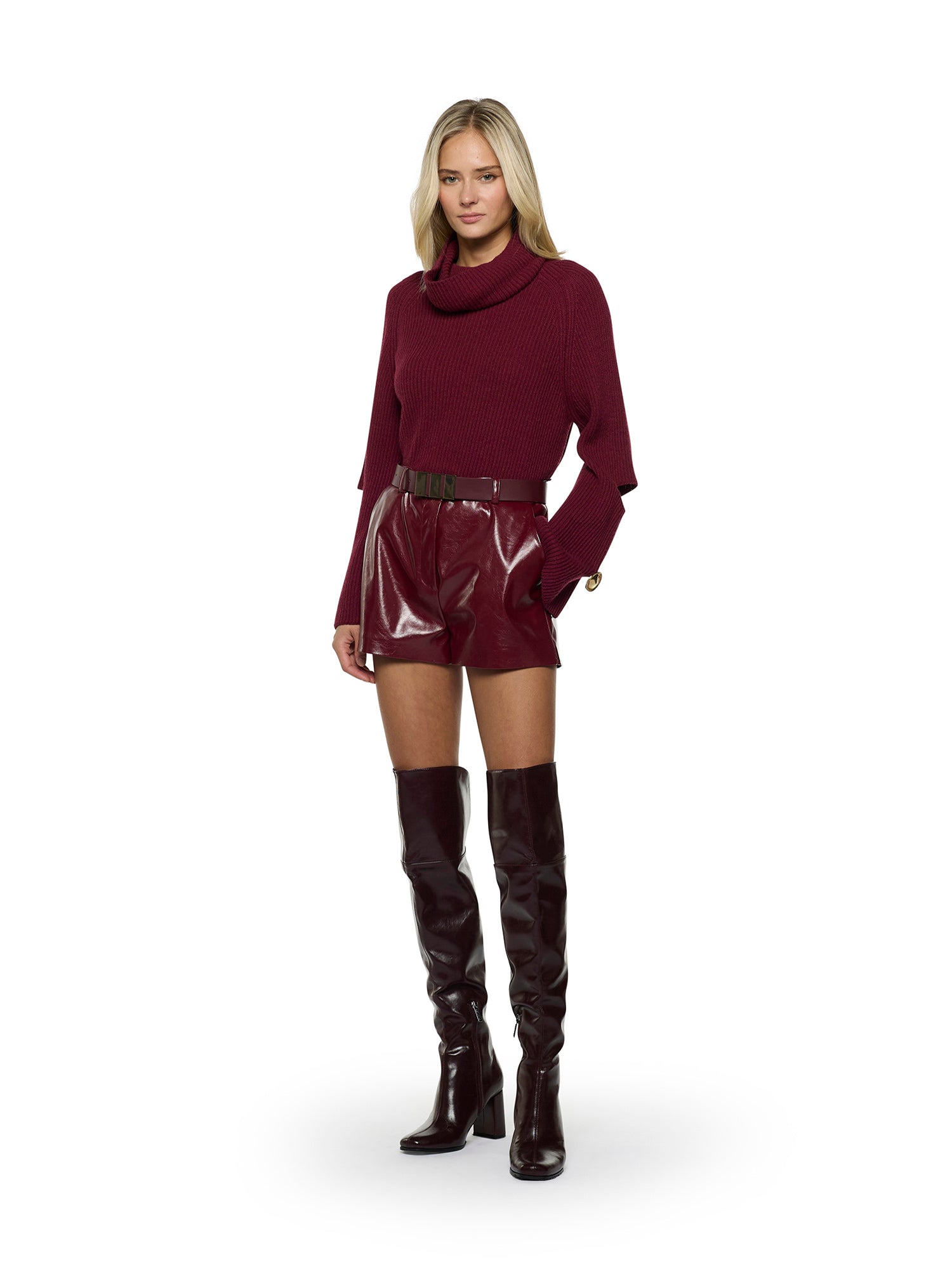 Dropped-neck sweater with openings at the elbows